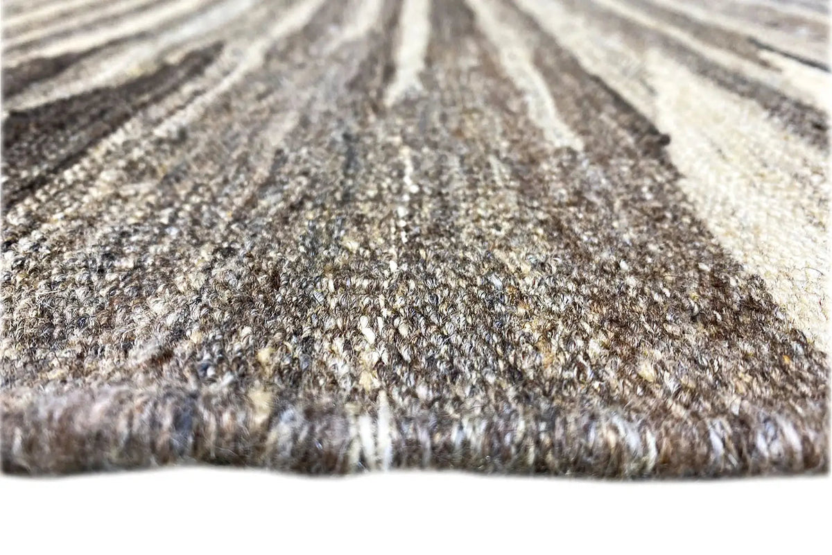 Close-up of a kilim rug with pile and a contrasting fringed edge
