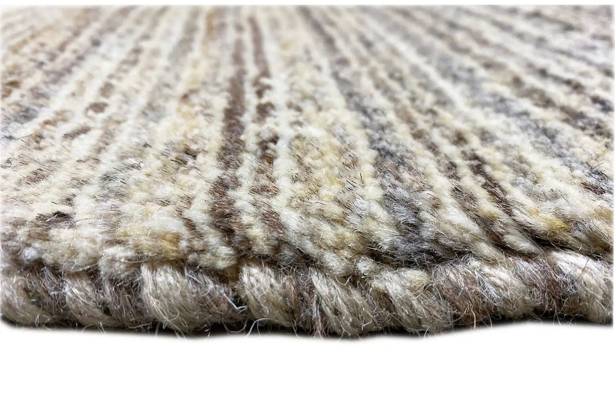 Gabbeh rug with dense pile along the edge, mottled beige-gray