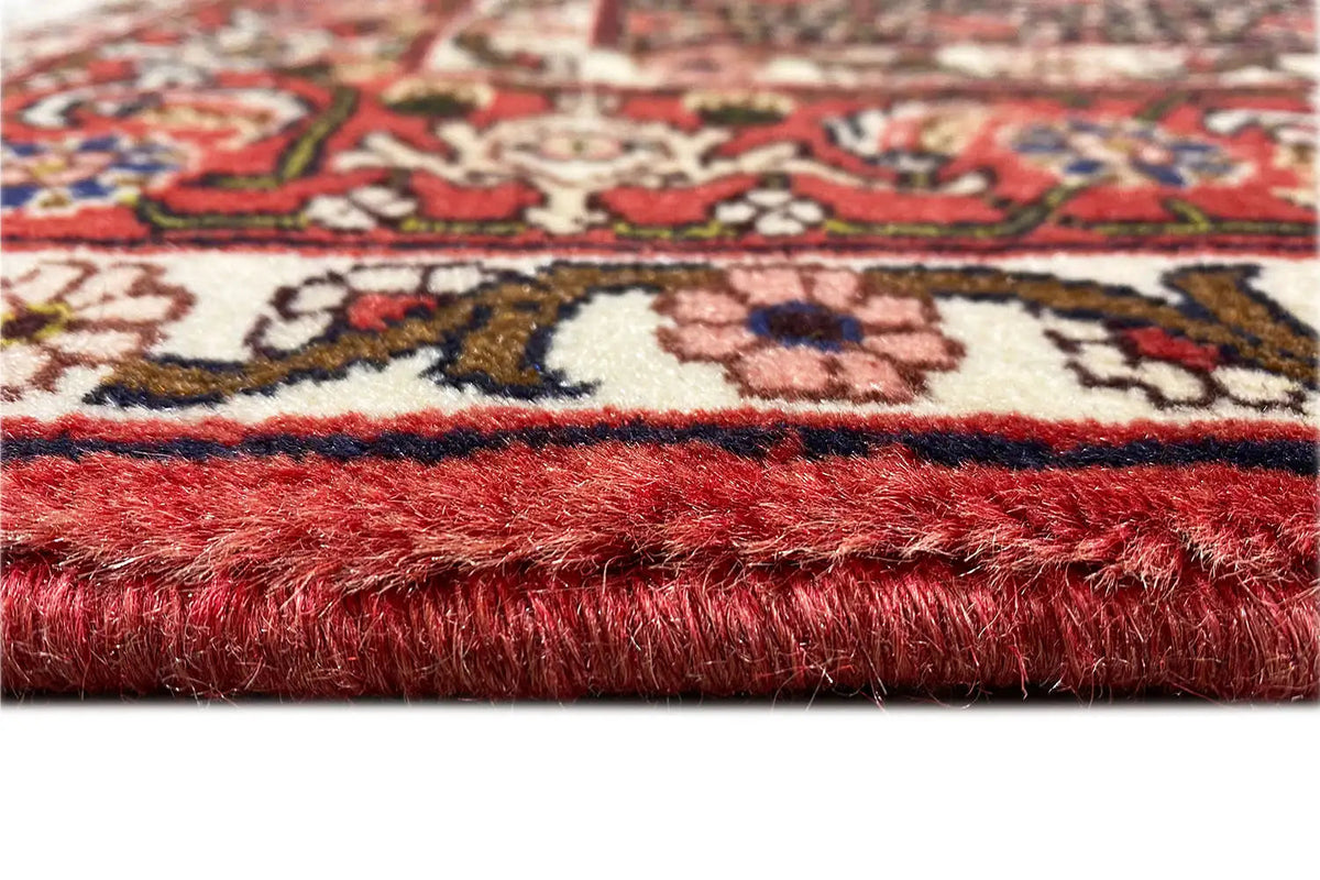 Hamadan rug: fringes and pile cut, accented in red