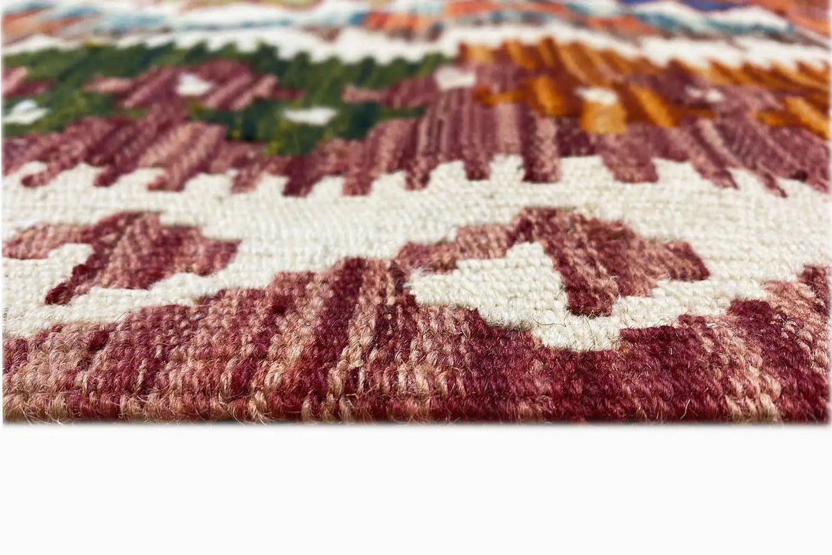 Afghan kilim (148x95 cm) Detail of the weave structure: reddish-brown pattern on a light background
