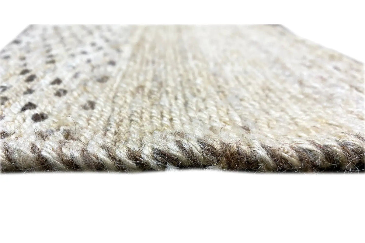 Kelim Qashqai rug close-up of the pile surface, light beige with dark dots