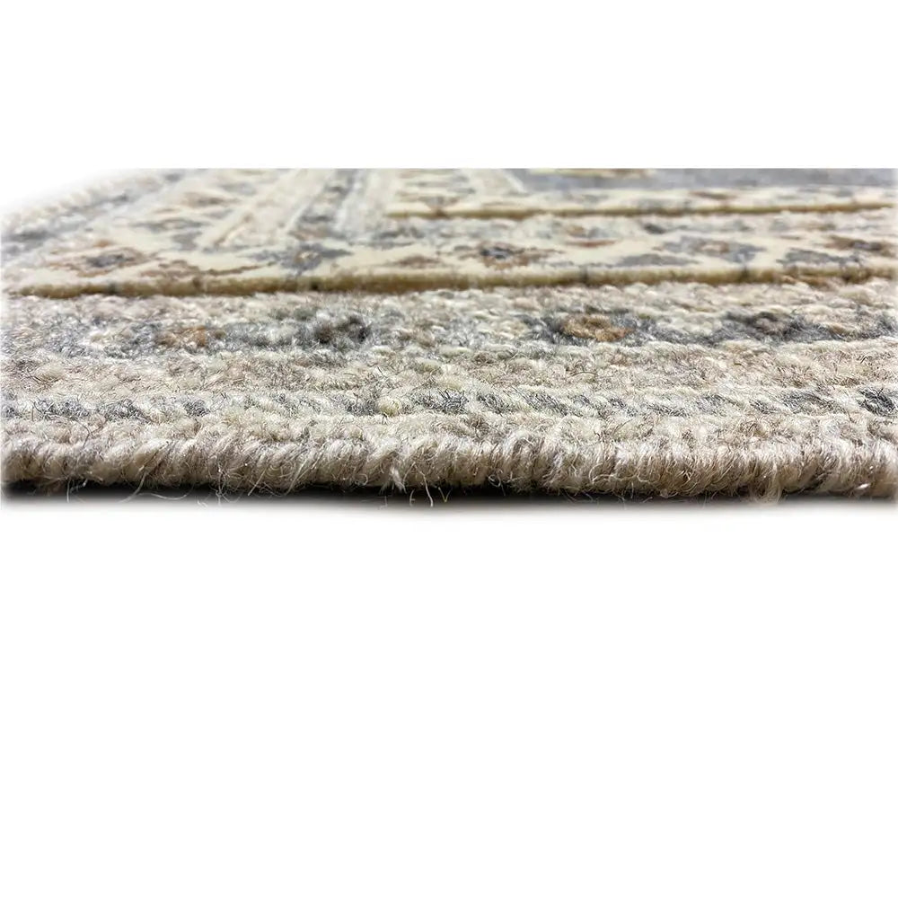 Carpet pile detail: fluffy blue-gray and light fibers at the edge