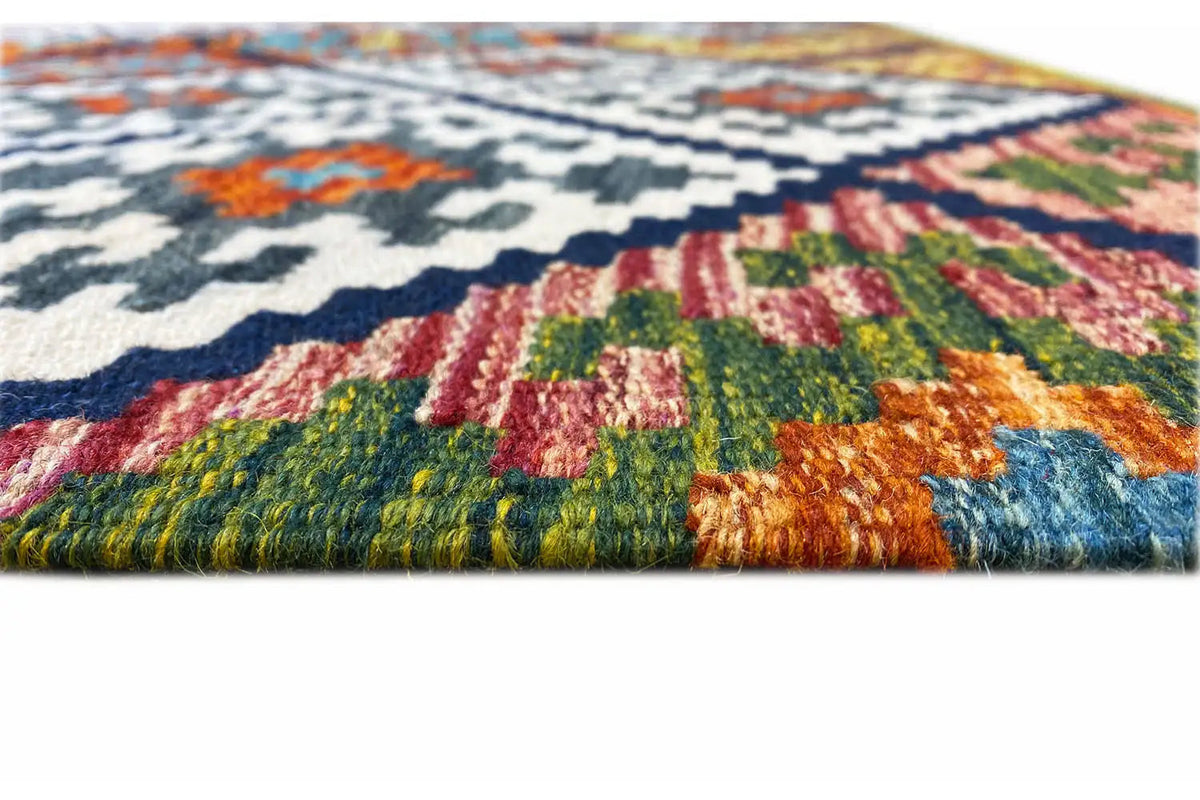 Kilim rug with fringed edge and colorful woven pattern