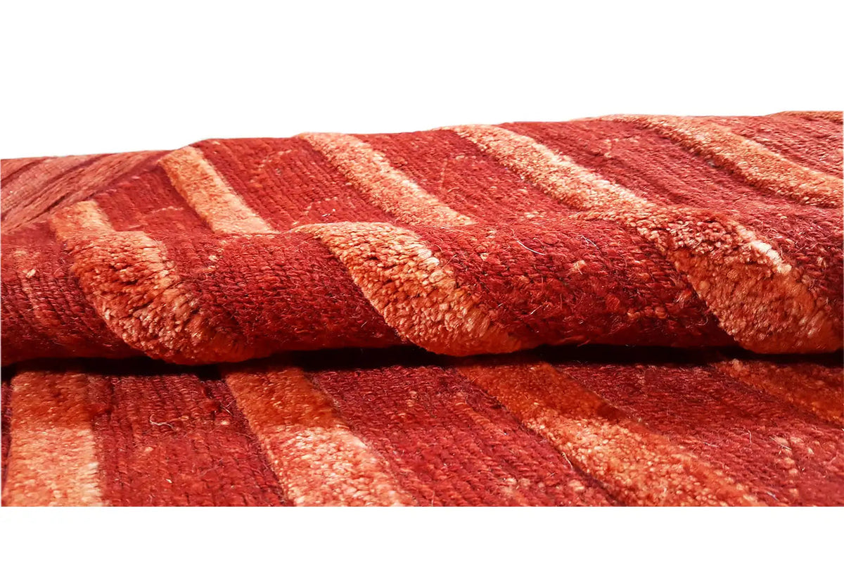 Gabbeh rug 196x147 cm, close-up of the pattern: red stripes with a woven texture