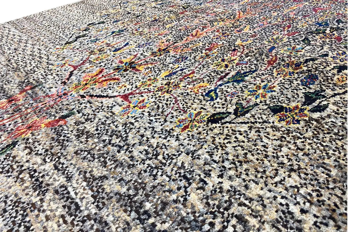 Lori gabbeh rug, detail view: dense gray pattern with colorful embroidery