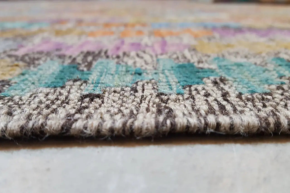 Carpet edge with dense pile, multicolored woven texture