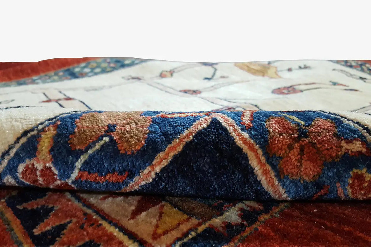 Oriental rug detail at the edge: colorful pile tufts in red, blue, and beige