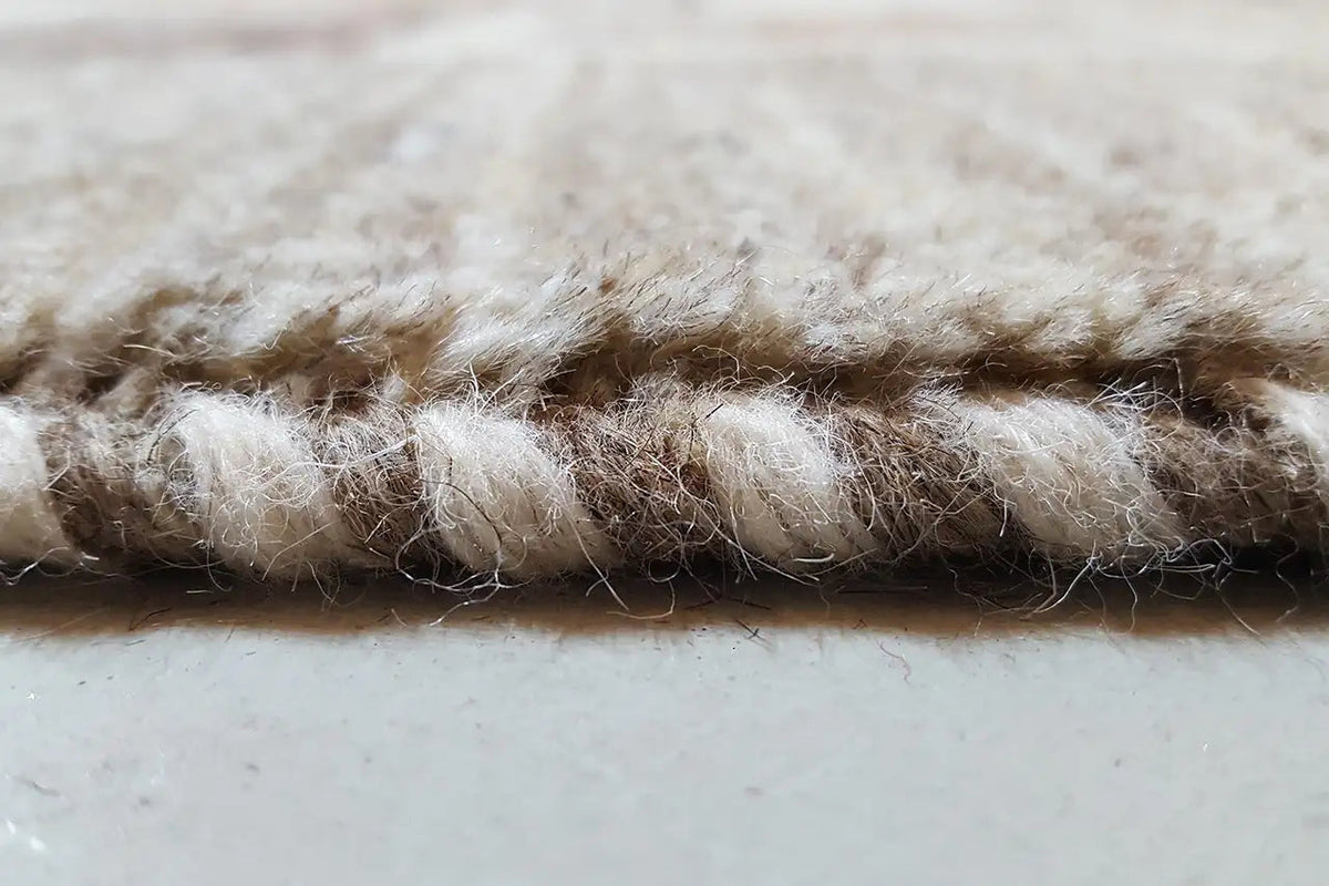 Gabbeh rug pile in detail, dense and fluffy, beige color tone