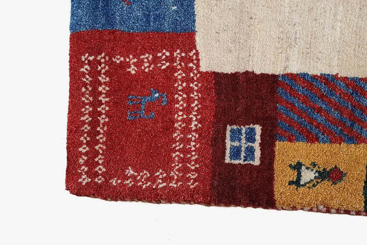 Gabbeh rug 210x149 cm Detail at the edge: red, blue and beige patterned area