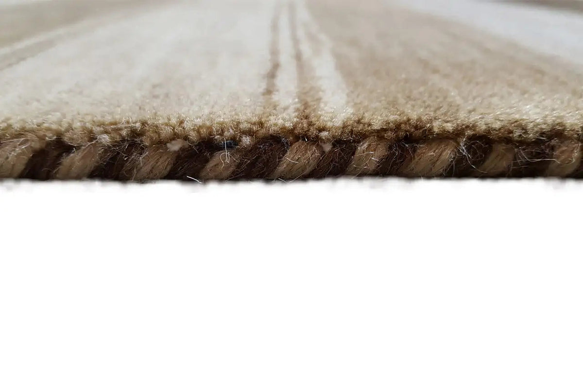 Gabbeh rug edge finish with dense pile and a frayed edge.