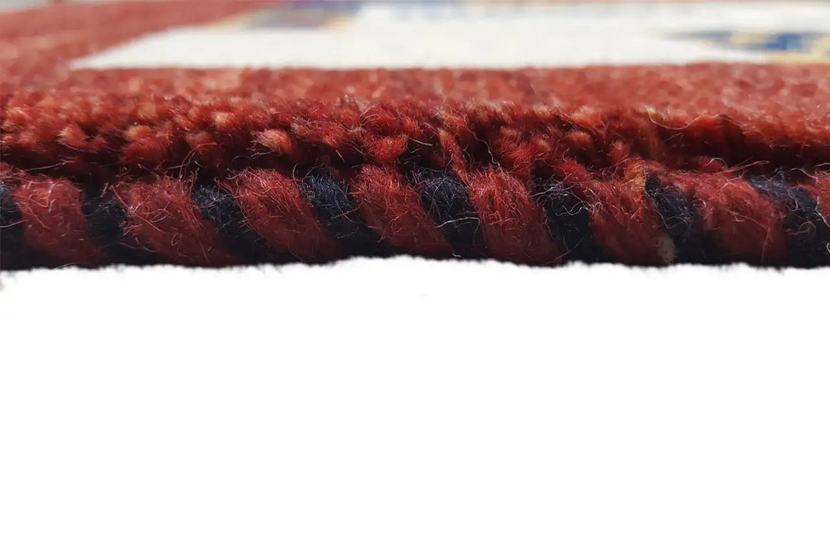 Close-up: red carpet edge with short fringe trim