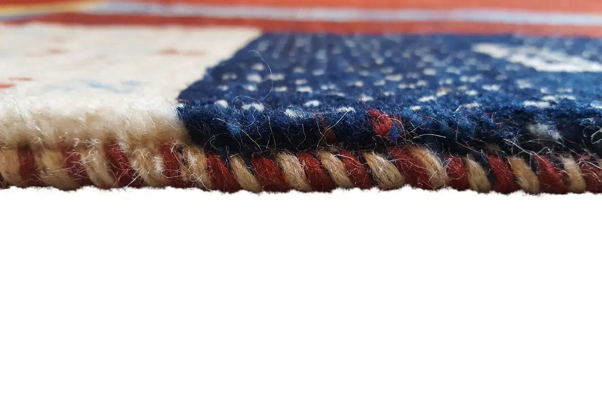 Gabbeh rug detail of the fringe seam with multicolored selvedge