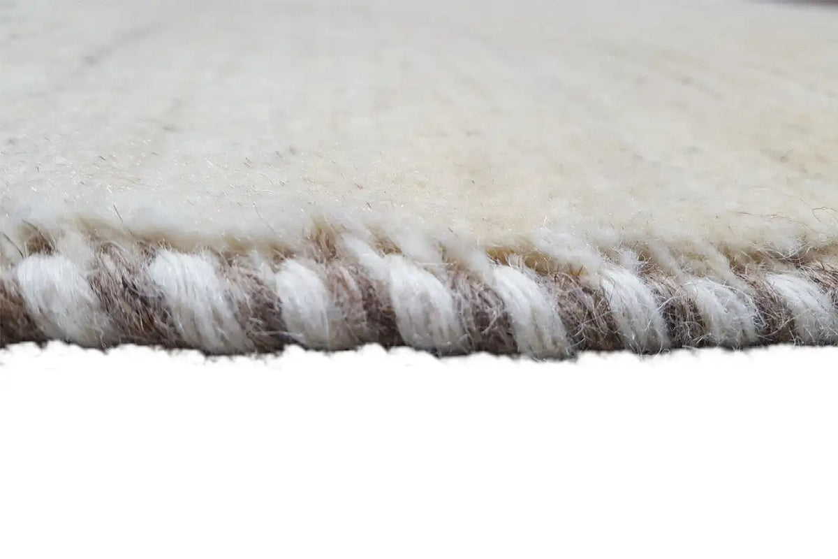 Gabbeh rug, close-up of the side fringes made of beige and brownish yarn