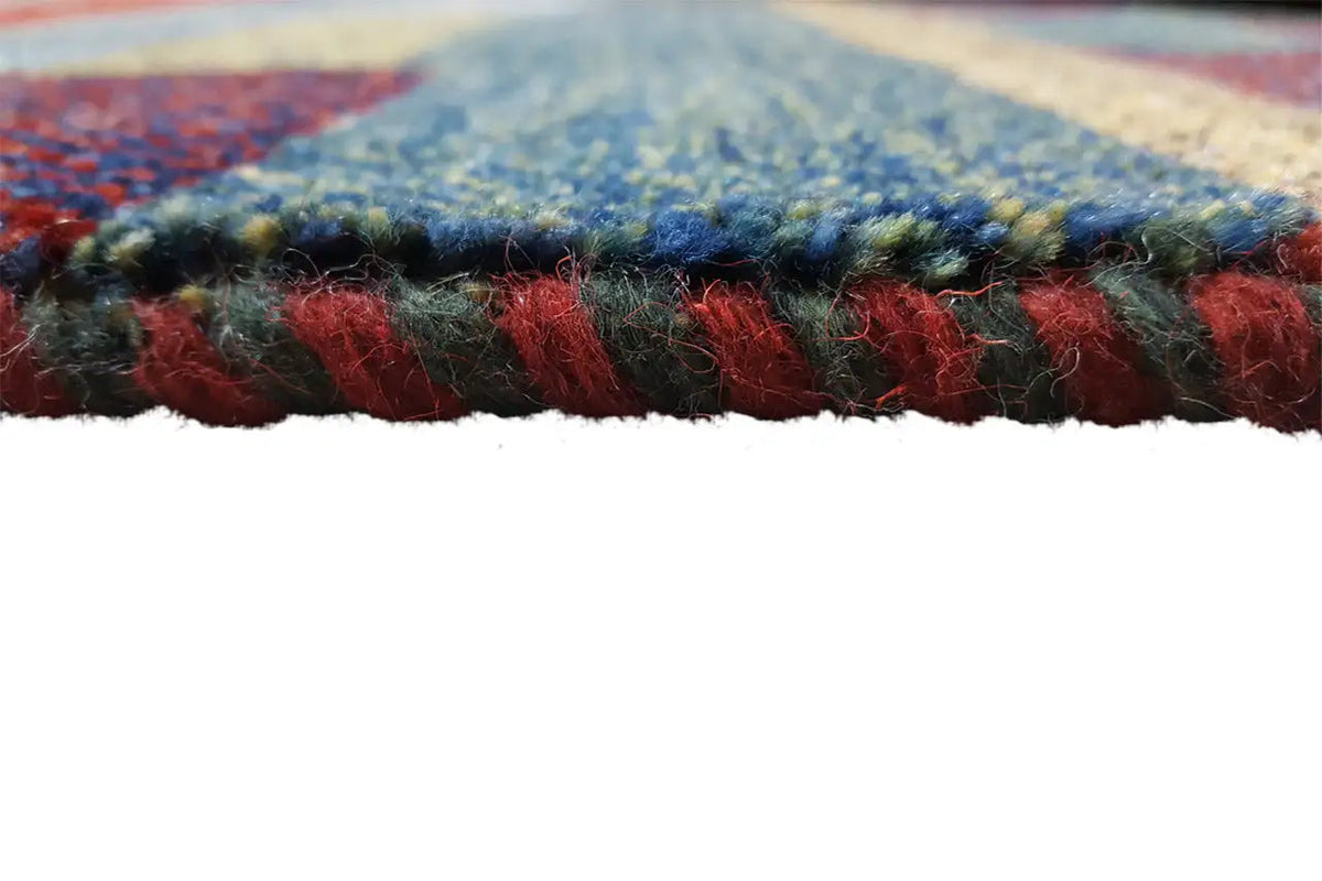 Gabbeh rug edge with short pile and fringes, mixed red and blue
