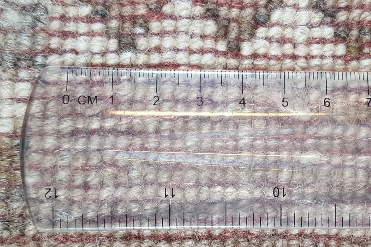 Gabbeh rug, measured with a ruler; textured woven edges in beige and brown tones