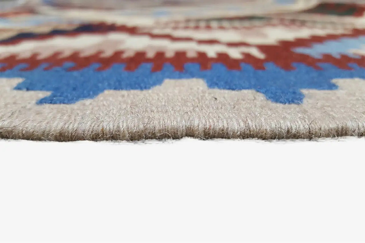 Kilim rug edge with short fringes and multicolored embroidery look