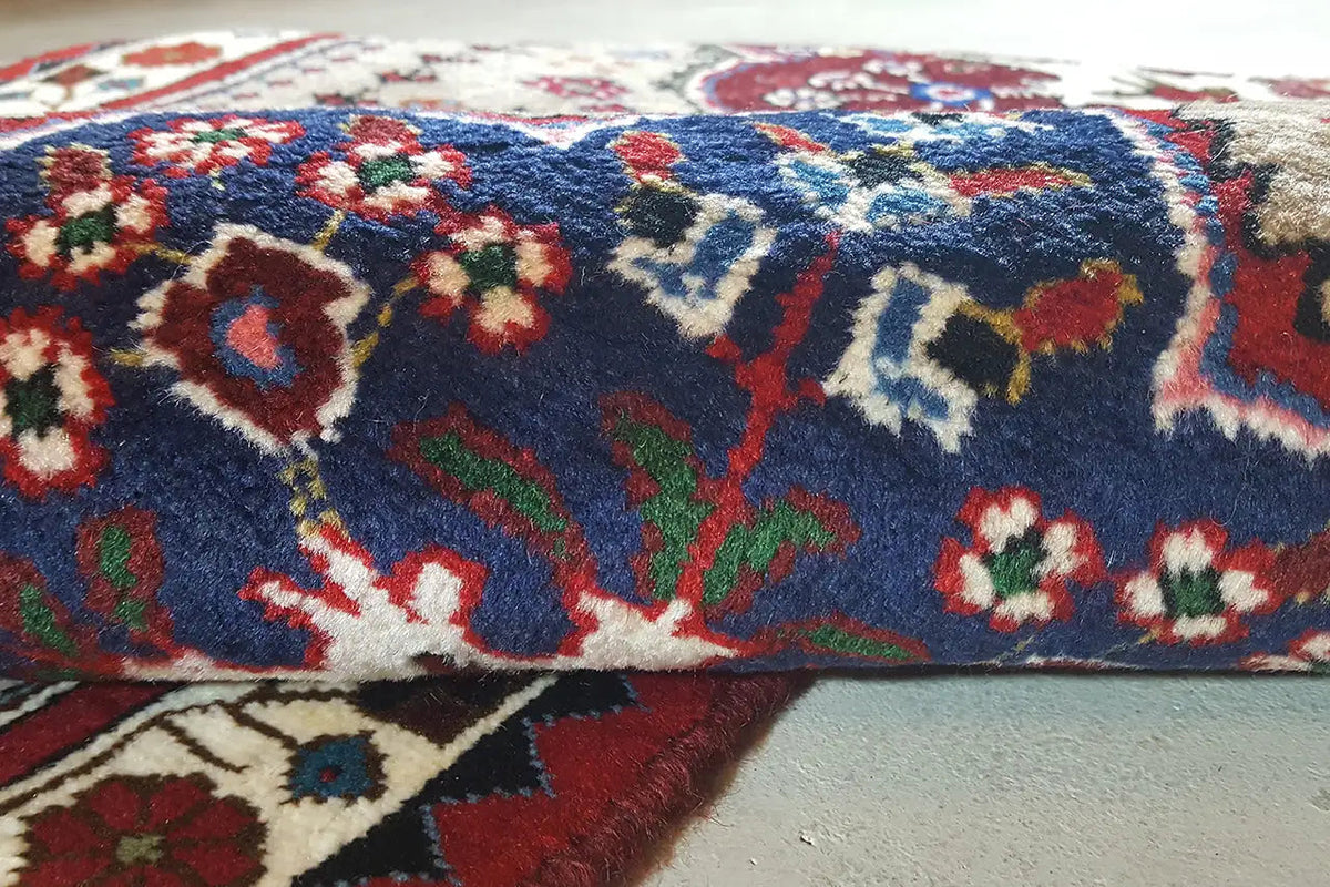 Close-up: runner with a multicolored ornamental pattern on a blue background