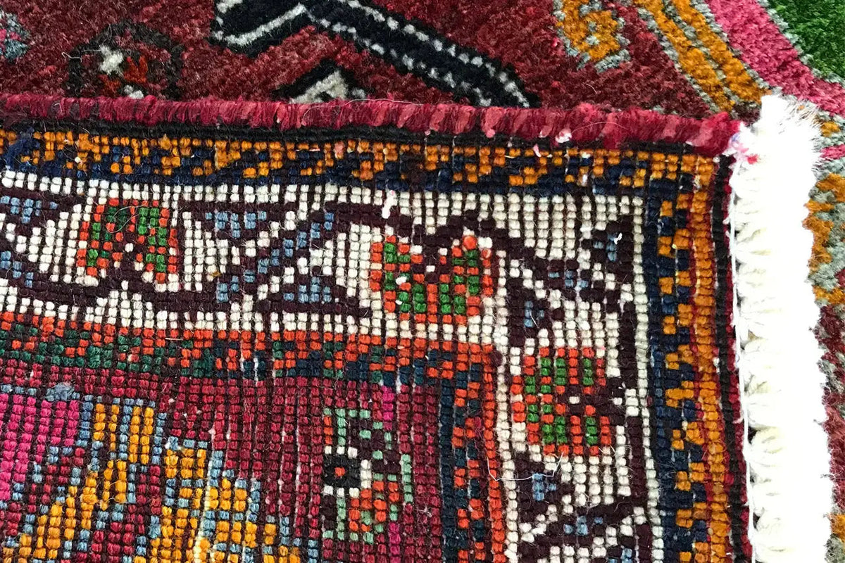 Rug edge with colorful embroidery and a geometric pattern