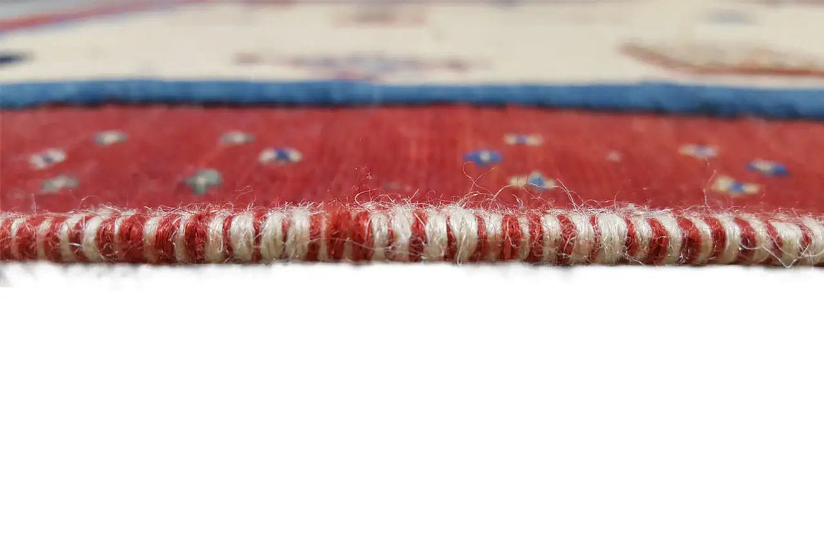 Soumakh rug edge 15407 with red border and braided fringe finish