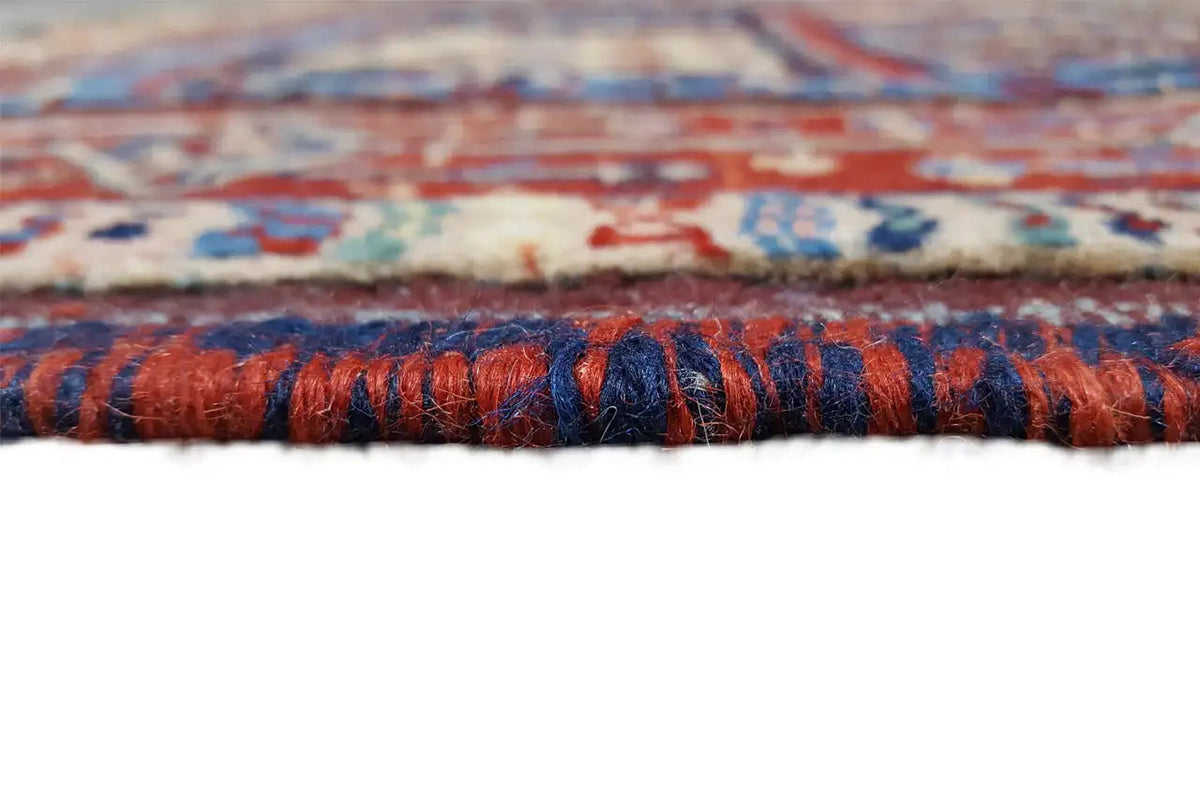 Close-up of the carpet edge with a multicolored selvedge and fringes