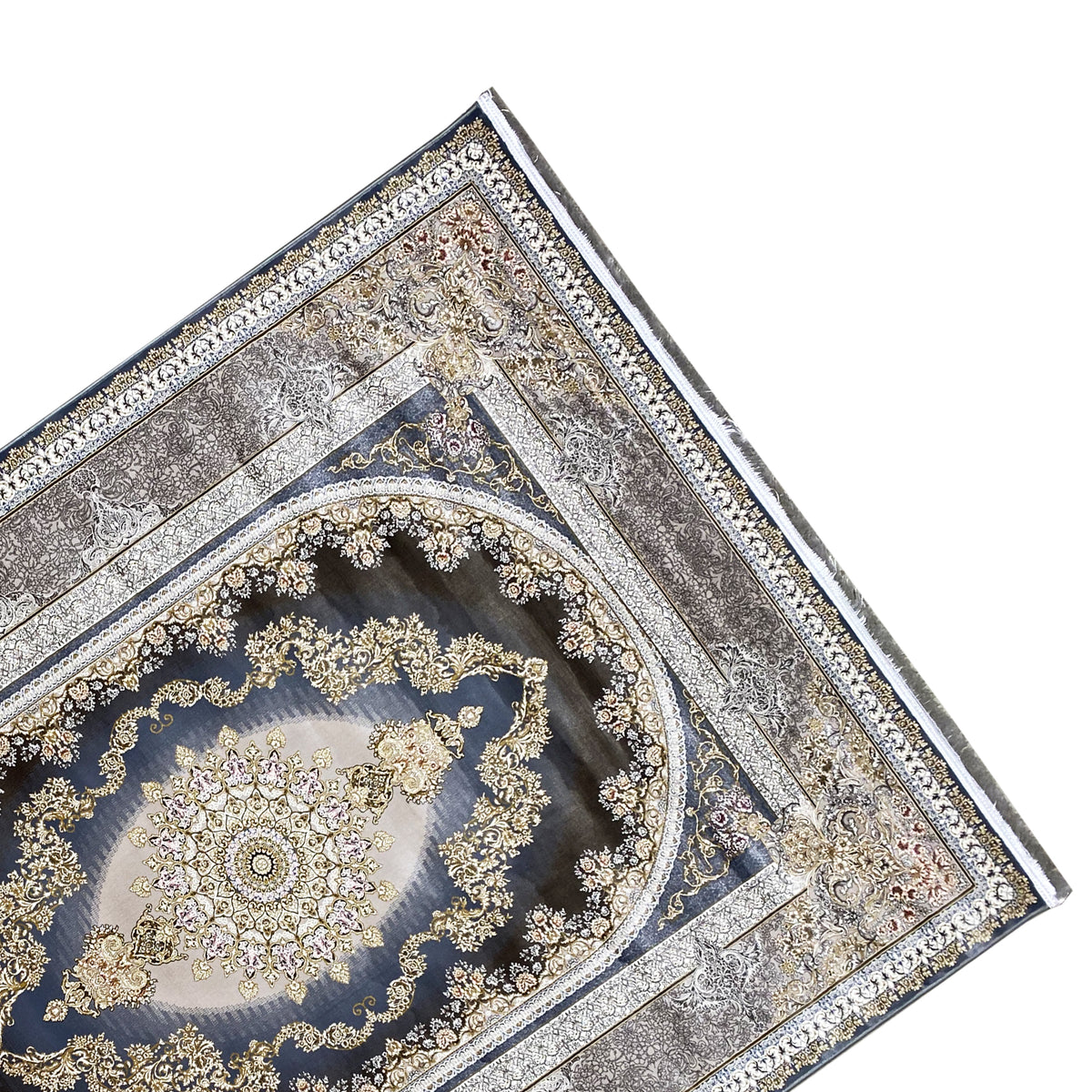 Rug at an angle: dark blue medallion, gold embellishments, surrounding borders.