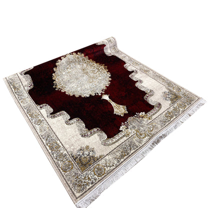 Red-burgundy carpet with a central circular motif, silver border design, and corner cartouches