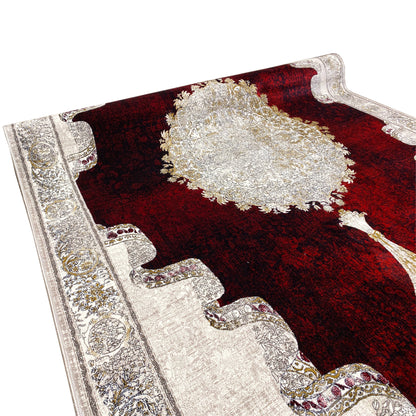 Burgundy-red carpet with a large central medallion and silver line details, partially cropped