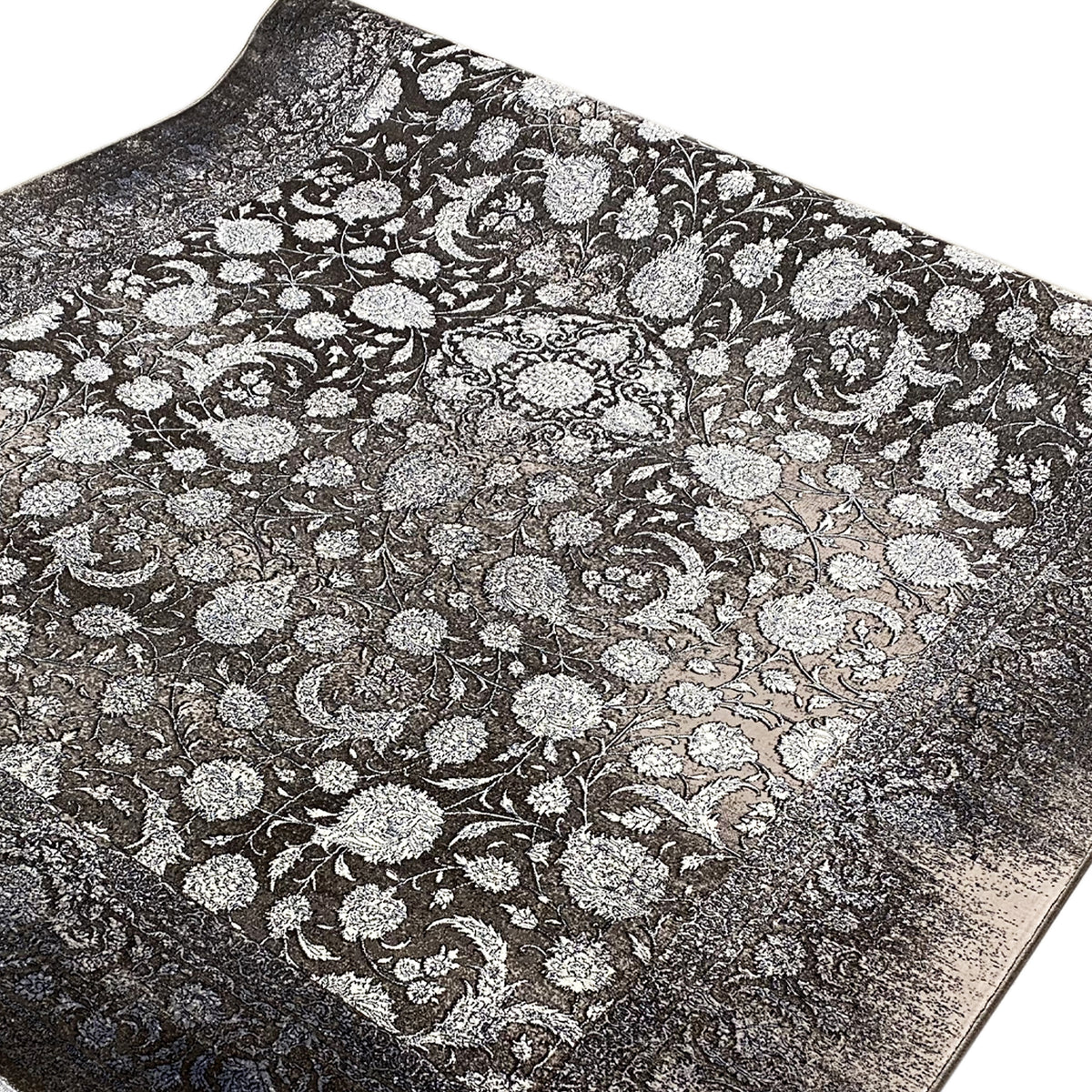 Rug 170x240 cm with a dense, silver floral pattern on a dark background