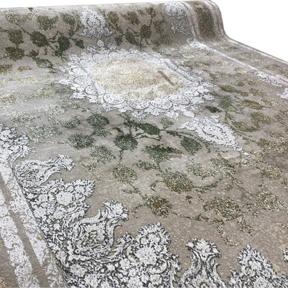 Rectangular rug with floral motifs in green, gold tones, and silver highlights
