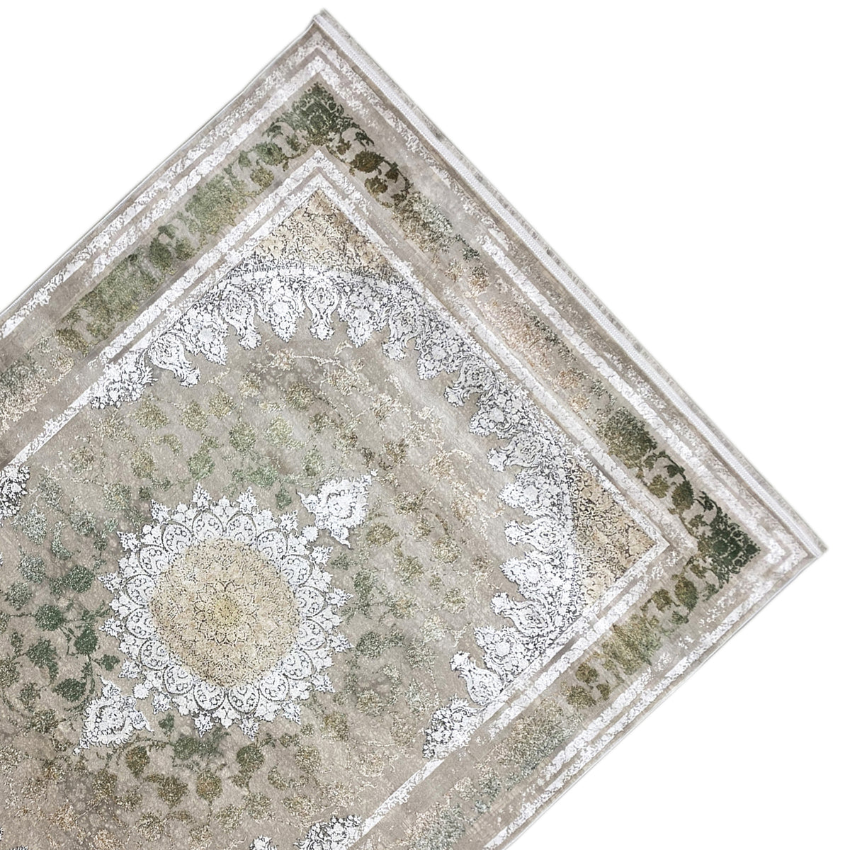 Rug 170x240 cm, diagonal view: silver ornamental band and green patterned areas