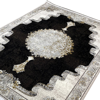 Carpet 170x240 cm close-up: black pile, large silver medallion, and golden tassels