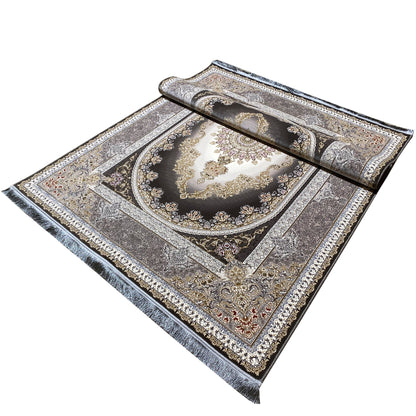 Smoke-gray rug at an angle with a centered medallion, fine border, and visible edge on the side.