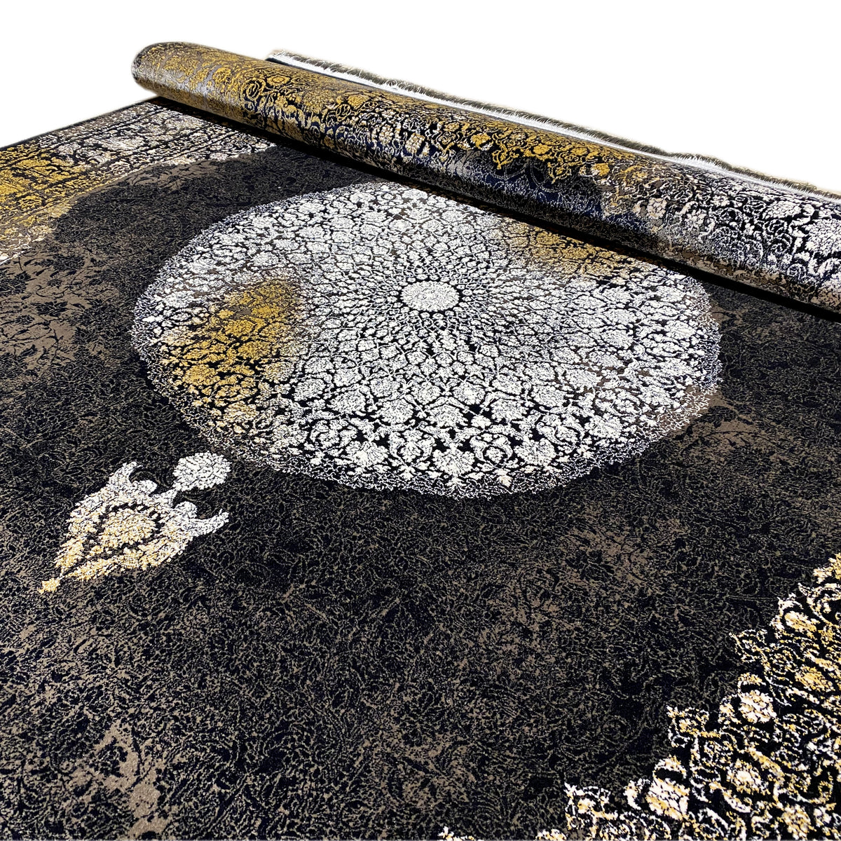 Close-up of an Oriental rug: silver medallion with golden-yellow highlights and black pile texture