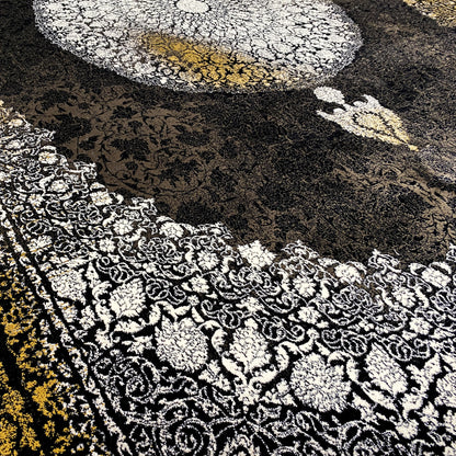 Carpet detail: black area with a silver ornamental carpet and a golden-yellow stripe