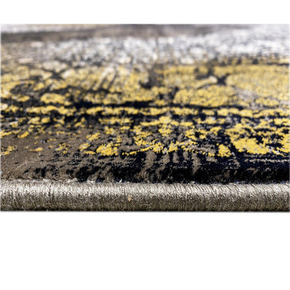 Carpet edge in detail: black pile with a silver border and gold-colored patterned stripes