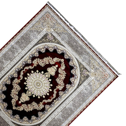 Red-and-silver rug with an oval ornamental medallion, black and gold decorative lines.