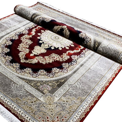 Red-silver carpet viewed from above: dense ornamentation, golden accents, medallion.
