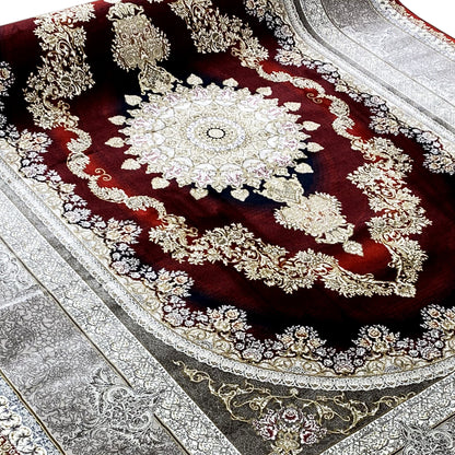 Oriental rug with a red medallion, a large ornament, and a silver side border