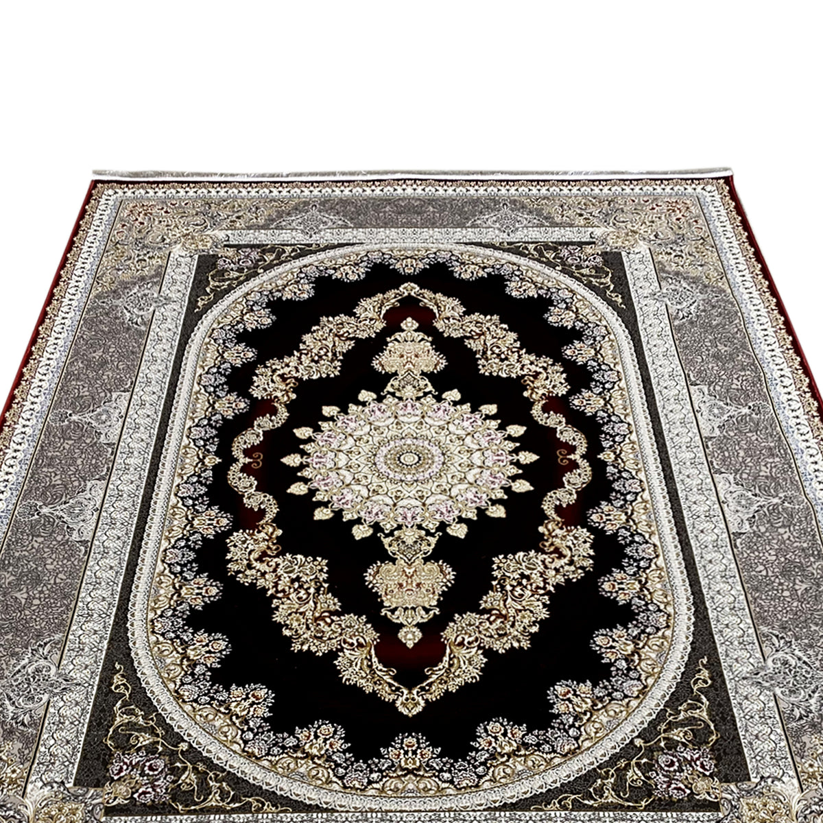 Red-and-silver carpet: close-up of the medallion with gold ornaments on a black background.