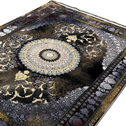 Close-up of a 170x240 cm rug: round medallion with golden swirling ornaments, dark background