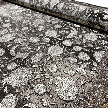 Velour rug with floral ornaments in silver on a dark background