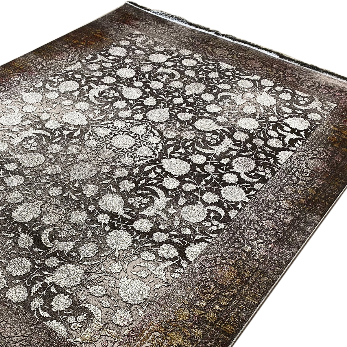 Rug with a large floral and vine pattern in light beige, framed in dark brown, with fringe