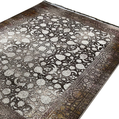 Rug with a large floral and vine pattern in light beige, framed in dark brown, with fringe