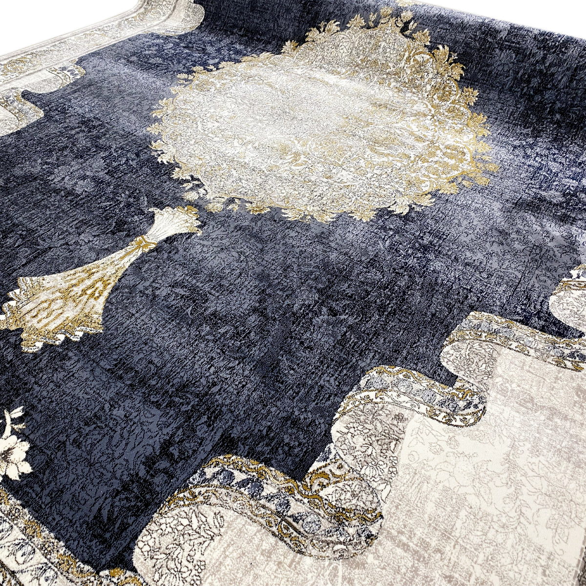 Rug surface with dark blue, a large cream circular motif, and golden ornamental elements