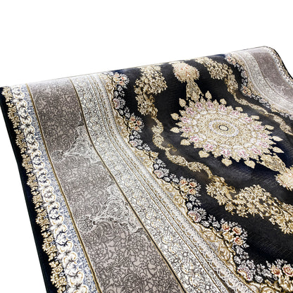 Rug detail: dark pile with a silver medallion, gold ornaments, and a border trim