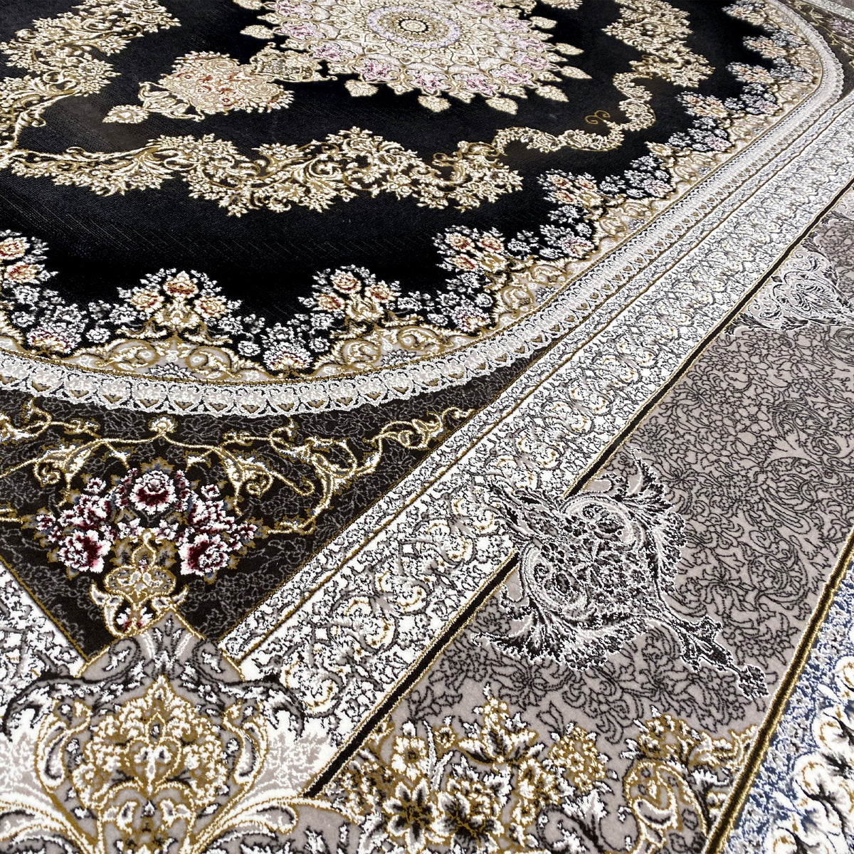 Close-up of carpet: floral gold and silver elements on a black background