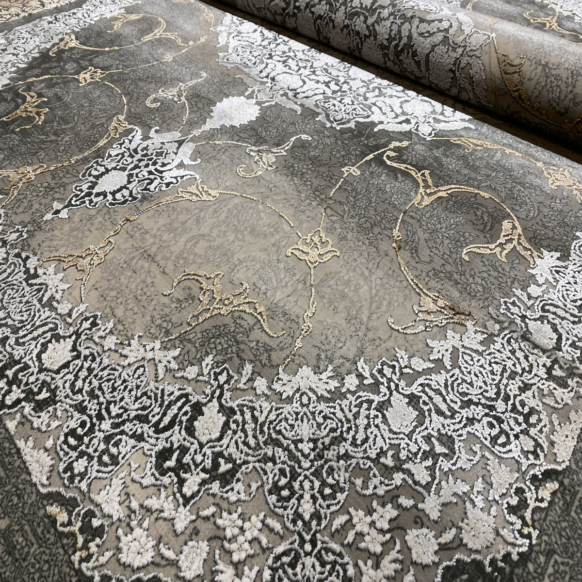 Smoke-brown rug with gold and white ornamental patterns