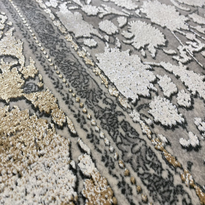 Close-up: silver-gray rug with floral ornaments and gold accents