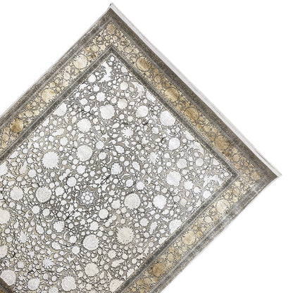 Rectangular silver-gold rug with floral patterns, detailed decorative border