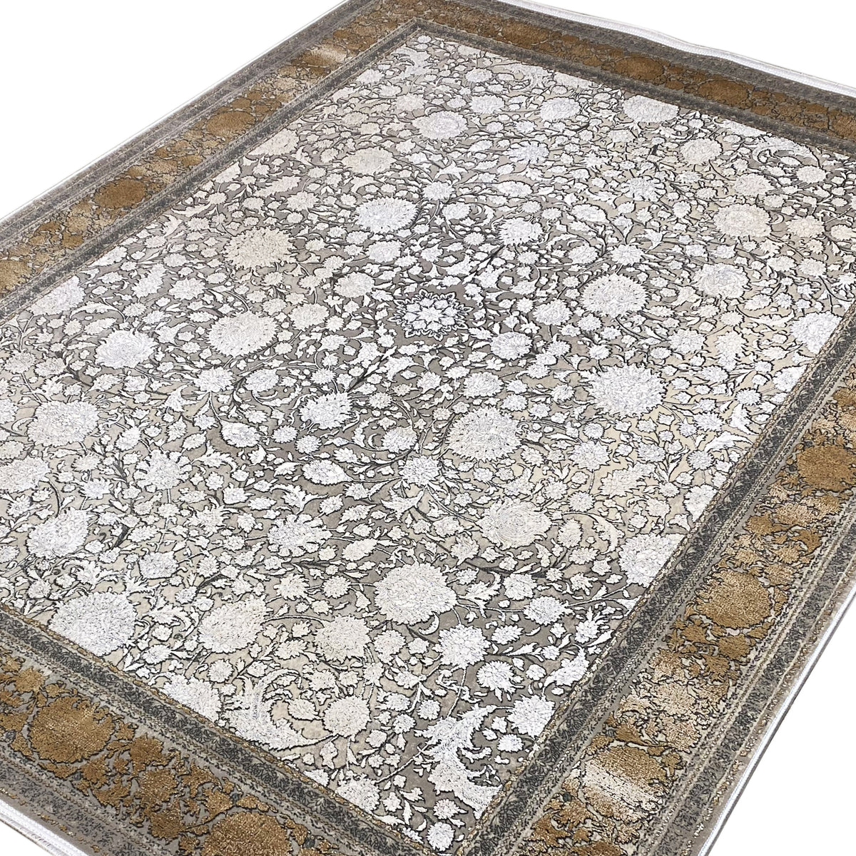 Silver-gold carpet with floral motifs and a border, viewed from above at an angle